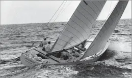  ?? Associated Press ?? YACHTSMAN, SAILMAKER
Ted Hood is second from left aboard the Intrepid in this photograph from 1970.