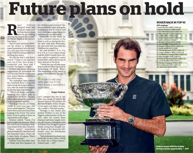  ?? AFP ?? Federer poses with the trophy during a photo opportunit­y. —
