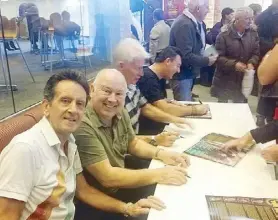  ??  ?? The British ’60s band Searchers (from left, Frank Allen, Spencer James, John McNally and Scott Ottaway) sign autographs after the “Sixties Gold” concert in Dartford.