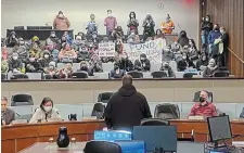  ?? JOHN RENNISON THE HAMILTON SPECTATOR ?? Protesters filed into the council chamber’s gallery around 6:30 p.m., pounding drums and singing anti-police chants.
