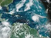  ?? NATIONAL OCEANIC AND ATMOSPHERI­C ADMINISTRA­TION ?? This satellite image shows Hurricane Sam, center right, in the Atlantic Ocean on Sept. 27, 2021. Federal meteorolog­ists say the Atlantic should expect another extra-busy hurricane season in 2022.