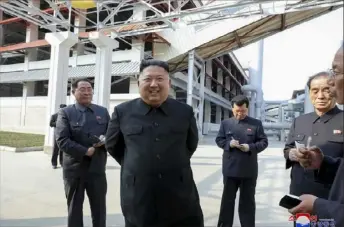  ?? Korean Central News Agency/Korea News Service via AP ?? North Korean leader Kim Jong Un, center, visits a fertilizer factory on Friday in Sunchon, South Pyongan province, near Pyongyang, North Korea.