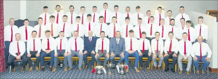  ?? (Pic: Catherine Sheehan) ?? The Ballygibli­n hurling panel and mentors, pictured at their victory social last Friday in The Firgrove Hotel, proudly displaying the silverware garnered during a very successful year.