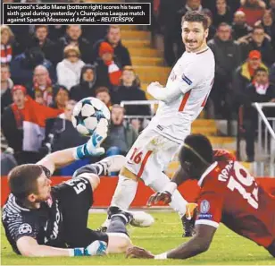  ??  ?? Liverpool’s Sadio Mane (bottom right) scores his team sixth goal during yesterday’s Champions League match against Spartak Moscow at Anfield. – REUTERSPIX