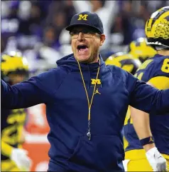  ?? RICK SCUTERI/ASSOCIATED PRESS 2022 ?? Michigan coach Jim Harbaugh has had an eventful offseason, from interviewi­ng with the Denver Broncos to talking with the NCAA about possible violations in Wolverines’ program and the firing of an assistant coach.