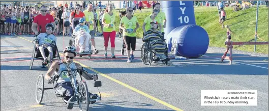  ?? JOE GIBBONS/THE TELEGRAM ?? Wheelchair racers make their start in the Tely 10 Sunday morning.