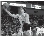  ?? AP/NATI HARNIK ?? Minnesota’s Gabe Kalscheur goes for a layup during the second half in an NCAA Tournament first-round game in Des Moines, Iowa. Kalscheur had 24 points as Minnesota won 86-76.