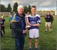  ??  ?? Patrick Murphy receives the cup from Mick Hagan.