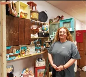  ?? REBECCA BLANCHARD — DIGITAL FIRST MEDIA ?? Denise Berner, co-owner of Barn Fresh Vintage Market, readies for the store’s grand reopening weekend. The store had to close for several months due to smoke and water damage from a nearby fire.