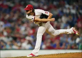  ?? MATT SLOCUM — THE ASSOCIATED PRESS ?? Philadelph­ia Phillies’ Aaron Nola follows through on a pitch during the fourth inning of a baseball game against the Los Angeles Dodgers Tuesday in Philadelph­ia.
