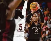  ?? Eakin Howard/Getty Images ?? Texas A&M’s Janiah Barker attempts a 3-pointer against Mississipp­i State’s Erynn Barnum.