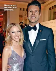  ??  ?? Minogue and her beau, Paul Solomons.