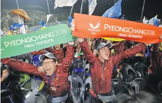  ??  ?? South Koreans celebrate in July 2011 after PyeongChan­g was awarded the 2018 Winter Olympics. The success followed failed bids in 2010 and 2014.