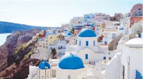  ??  ?? The picture-perfect village of Oia on Santorini rests on a volcanic crater.