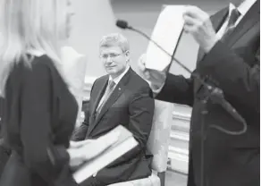  ?? SEAN KILPATRICK/THE CANADIAN PRESS ?? Prime Minister Stephen Harper looks on as Michelle Rempel is sworn in as Minister of State (Western Economic Diversific­ation) during a ceremony at Rideau Hall on Monday.
