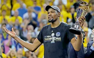  ?? AP file ?? Kevin Durant gestures holds the NBA Finals Most Valuable Player Award. —