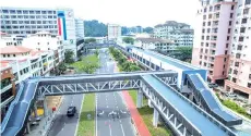  ??  ?? The skybridge in Kota Kinabalu that links Api-Api Centre, Centre Point, Warisan Square, Asia City and Oceanus.