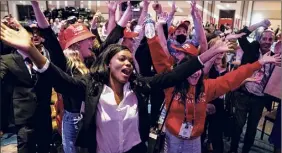  ??  ?? Attendees dance after watching former President Donald Trump speak at the Conservati­ve Political Action Conference on Sunday.