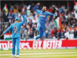  ?? Reuters ?? ↑ India’s Hardik Pandya celebrates taking the wicket of Pakistan’s Shoaib Malik during their World Cup match on Sunday.