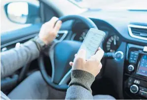  ?? GEBER86/GETTY IMAGES ?? A pair of bills have been proposed that will crack down on texting while driving, but texting or checking your cell phone while at a red light can be just as dangerous.