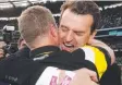  ??  ?? Brendon Gale and Damien Hardwick embrace.