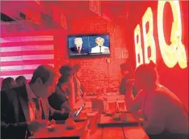  ?? Kate Linthicum Los Angeles Times ?? THE U.S. PRESIDENTI­AL DEBATE is televised in a Mexico City barbecue restaurant. “I feel envy,” one patron, a college professor, said. “In Mexico, the debates are so serious and formal and boring that nobody watches.”