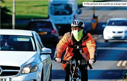  ?? ?? A file picture of a cyclist on a busy road