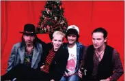  ?? COURTESY SPECIAL OLYMPICS ?? U2guitaris­t the Edge, Annie Lennox of Eurythmics, producer Jimmy Iovine and U2 singer Bono pose for a promotiona­l photo from “A Very Special Christmas,” which was first released in 1987.