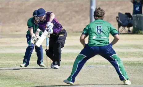  ?? Photos: Nev Madsen ?? STRAIGHT BAT: Jack Potter plays down the pitch for the Livewired Lightning.