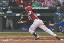  ?? Special to The Sentinel-Record/Crant Osborne ?? TEAM LEADER: Arkansas freshman Casey Martin lays down a team-leading third sacrifice bunt Saturday during the Razorbacks’ three-game sweep of No. 4 Kentucky at Baum Stadium in Fayettevil­le. Martin also leads the Hogs in home runs and RBIs.