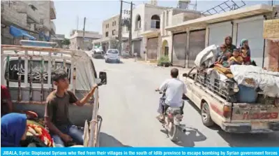  ??  ?? JIBALA, Syria: Displaced Syrians who fled from their villages in the south of Idlib province to escape bombing by Syrian government forces return home shortly before a truce fell apart between rebels and President Bashar Al-Assad’s regime yesterday.