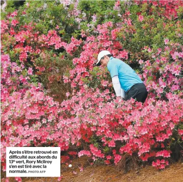  ??  ?? Après s’être retrouvé en difficulté aux abords du 13e vert, Rory Mcllroy s’en est tiré avec la normale. PHOTO AFP