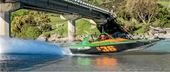  ?? PHOTO BY MIKE SMITH / SSS ENGINEERIN­G ?? John Derry and Brent Hefford emerge from under the Dart River Bridge heading upstream on the final day of racing in the 2016 NZ jet boat marathon.