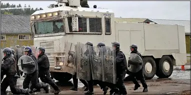  ??  ?? Achtung! British riot police train with the ‘antiquated’ German equipment bought by the mayor