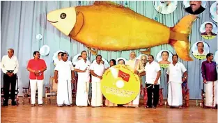  ??  ?? With their fish symbol in the backdrop, Thamil Makkal Thesiya Kutani (Tamil People’s Tamil Front) candidate C.V. Wigneswara­n at an election rally. The front earlier functioned as the Eelam People’s Revolution­ary Front (EPRLF) with the flower as their symbol. Also on the stage is Suresh Premachand­ran, a former MP.