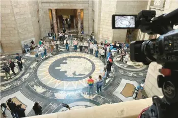  ?? NICK INGRAM/AP ?? Protesters gather before lawmakers debate a ban on gender-affirming care for minors May 19 in Nebraska.