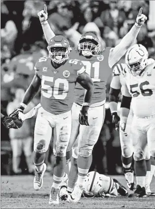  ?? DAVID EULITT/GETTY ?? Chiefs linebacker Justin Houson (50) celebrates with Derrick Nnadi after recovering a third-quarter fumble.