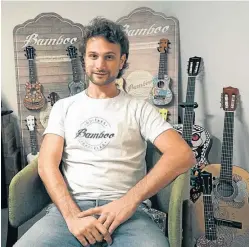  ?? AFP/ EITAN ABRAMOVICH ?? Entreprene­ur Federico Veleno poses for a photograph alongside items from his musical instrument brand, Bamboo.