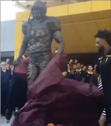  ?? THE ASSOCIATED PRESS ?? In this image made from video, a bronze statue of Pat Tillman is unveiled during a ceremony at Sun Devil Stadium in Tempe, Ariz.