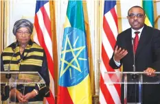  ??  ?? Liberian president Ellen Johnson Sirleaf with Ethiopian Prime Minister Hailemaria­m Desalegn, commended Ethiopia’s victory over Italian troops in the famous battle of Adwa saying it was a victory for the “African spirit”.
- Africa News