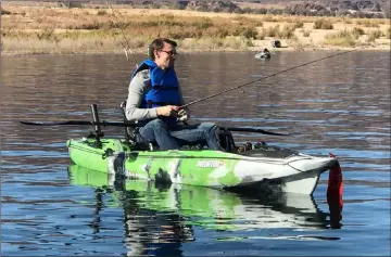  ?? Doug Nielsen ?? An angler recently enjoys a day of fishing at Lake Mead, a pastime that has seen an upsurge in participat­ion since the onset of COVID-19.