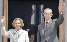  ?? PAUL BUCIUTA/THE ASSOCIATED PRESS FILES ?? Former Romanian King Michael I and his wife Anne wave from the balcony of the Peles Castle, in Sinaia, Romania. Anne has died at the age of 92.