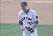  ?? ASHLEY LANDIS — THE ASSOCIATED PRESS ?? Astros pitcher Ryan Pressly reacts after striking out the A’s Khris Davis for the final out of the ninth inning of Game 4of their American League Division Series in Los Angeles on Thursday.