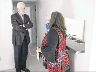  ?? RICARDO B. BRAZZIELL / AMERICAN-STATESMAN ?? U.S. Sen. John Cornyn speaks with Melinda Cantu at the SafePlace campus in Austin on Friday. Cornyn plans to introduce legislatio­n that would prioritize funding for domestic violence victims’ transition­al housing, prolong stay lengths so victims can...