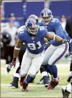  ?? AP Photo ?? Big Blue’s defensive, anchored by Justin Tuck, will have to lead the way if the team hopes to be successful in the playoffs, Tom Coughlin said.