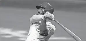  ?? AARON DOSTER/AP ?? Reds third baseman Eugenio Suarez bats against Cleveland on Aug. 4 in Cincinnati.