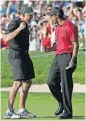  ?? [AP PHOTO] ?? In this June 15, 2008, photo, Tiger Woods celebrates with his caddie, Steve Williams, after sinking a birdie putt on the 18th green, forcing a playoff against Rocco Mediate, during the fourth round of the U.S. Open golf tournament at Torrey Pines in...