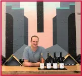  ??  ?? Blue Ox winemaker and co-founder Noah Kenoyer pours flights at his wine tasting room in Berkeley.