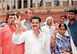  ?? AFP file ?? The first elected Maoist politician to the parliament Kameshwar Baitha gestures as he poses with supporters at Parliament House in New Delhi. —