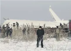  ??  ?? 0 Police guard the scene of the Fokker-100 crash